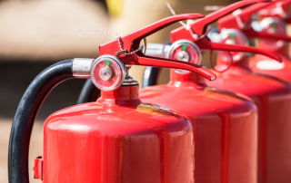 Fire extinguishers lined up in a row